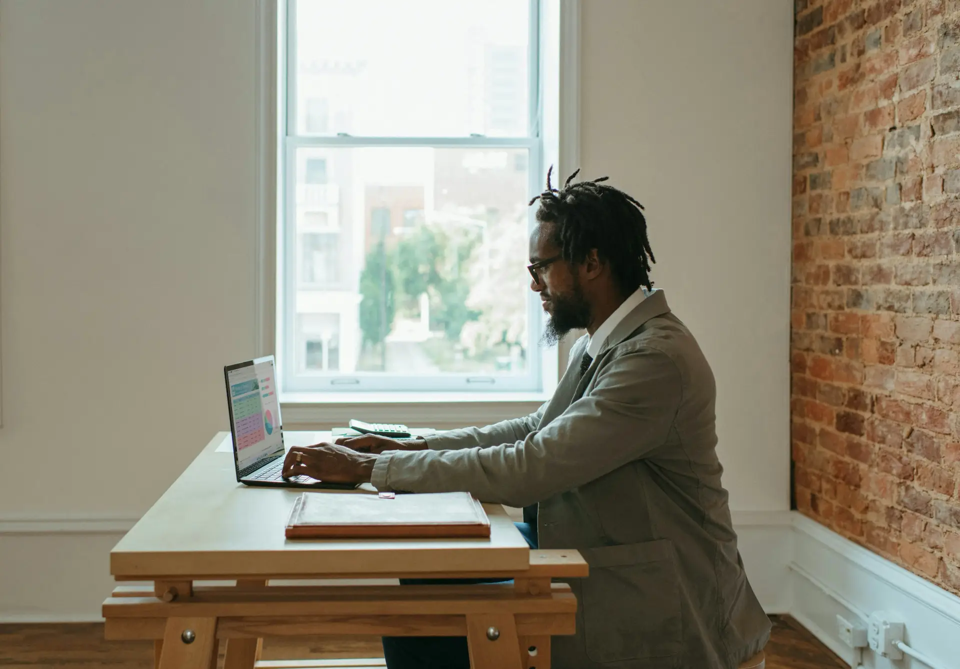 man working from coffee shop