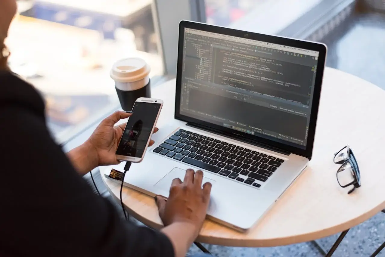 person working on laptop code