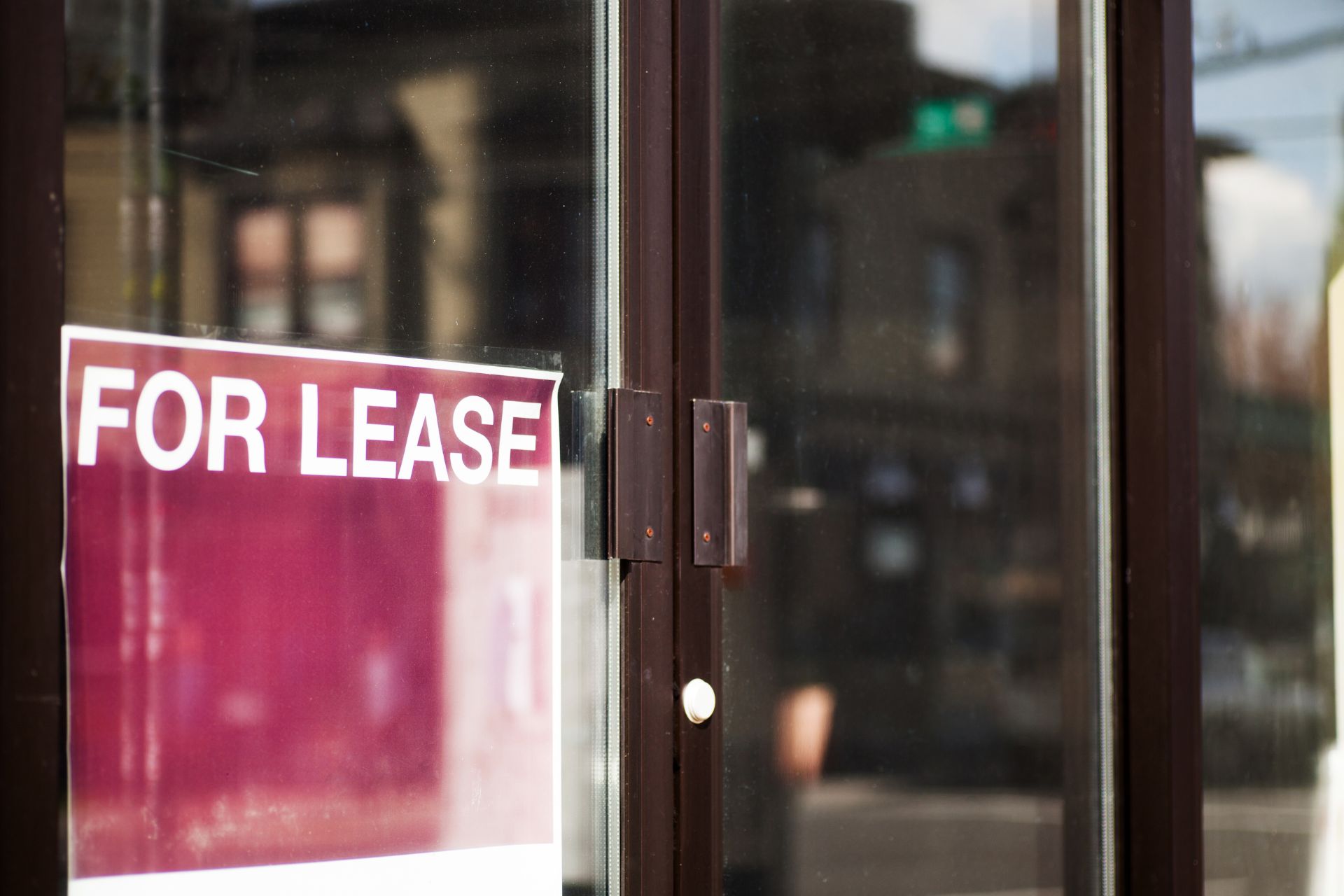 A sign advertising a commercial space available for lease