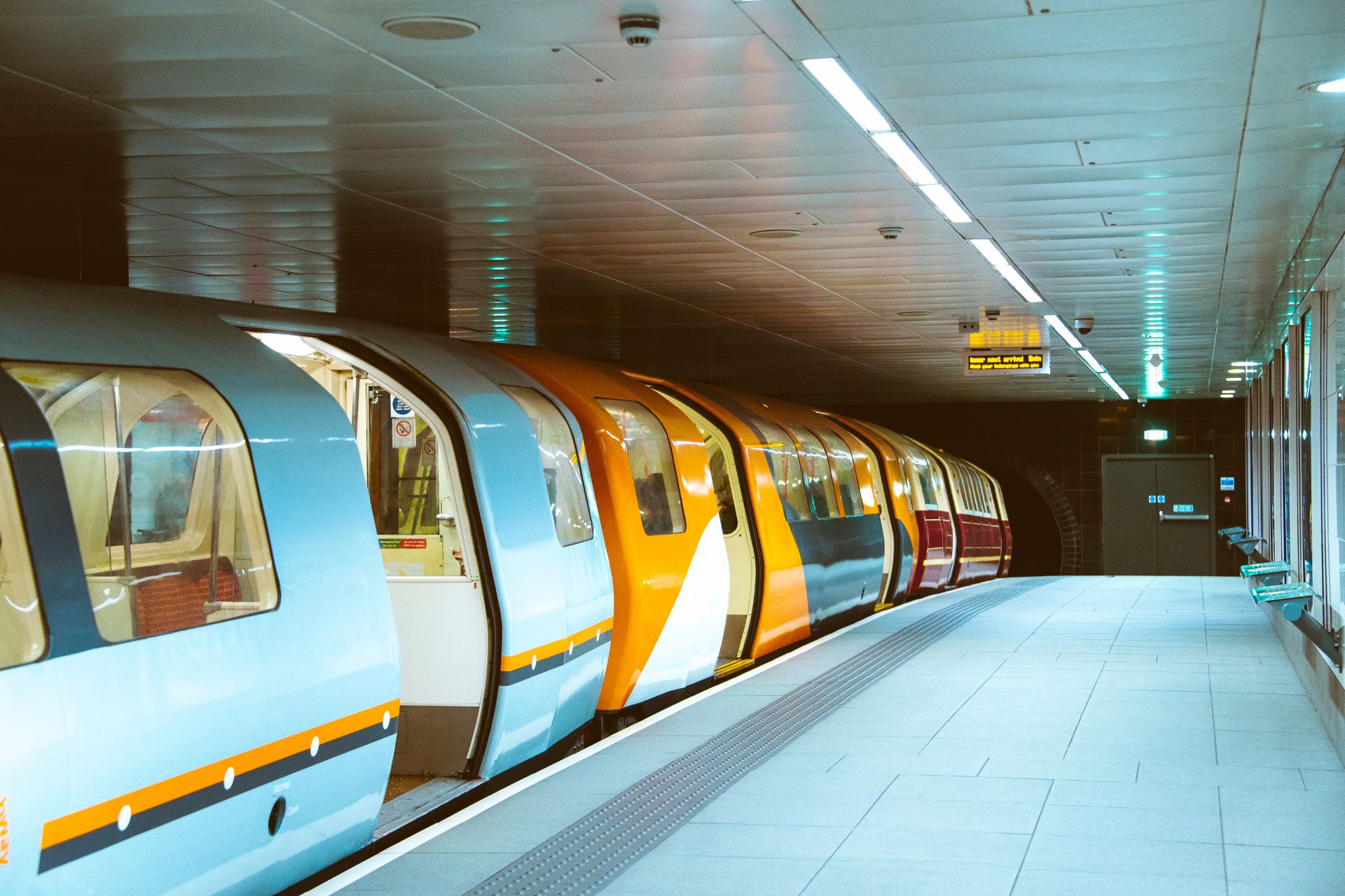 Glasgow Subway train waiting at platform with open doors