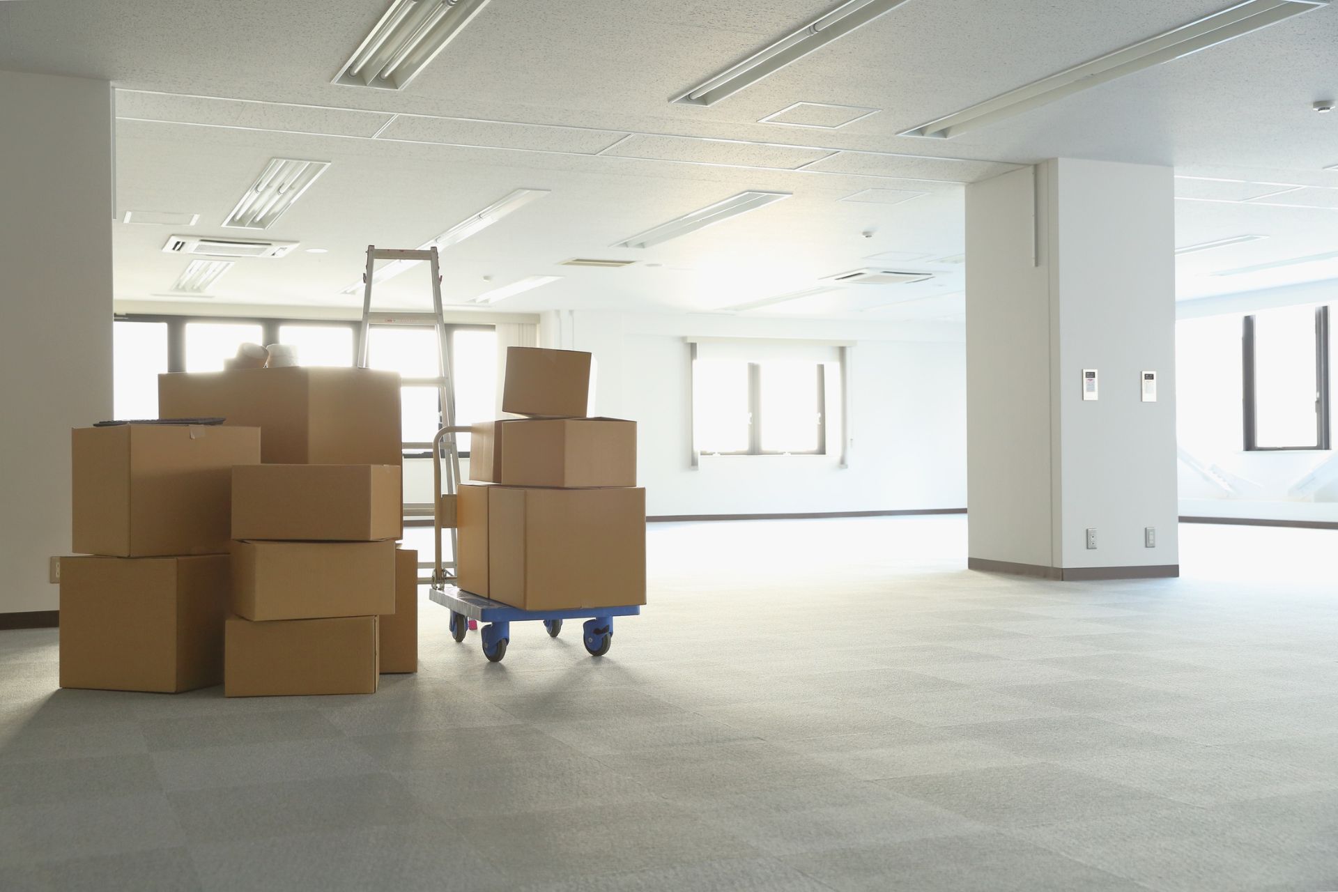 empty office space with stacked cardboard boxes