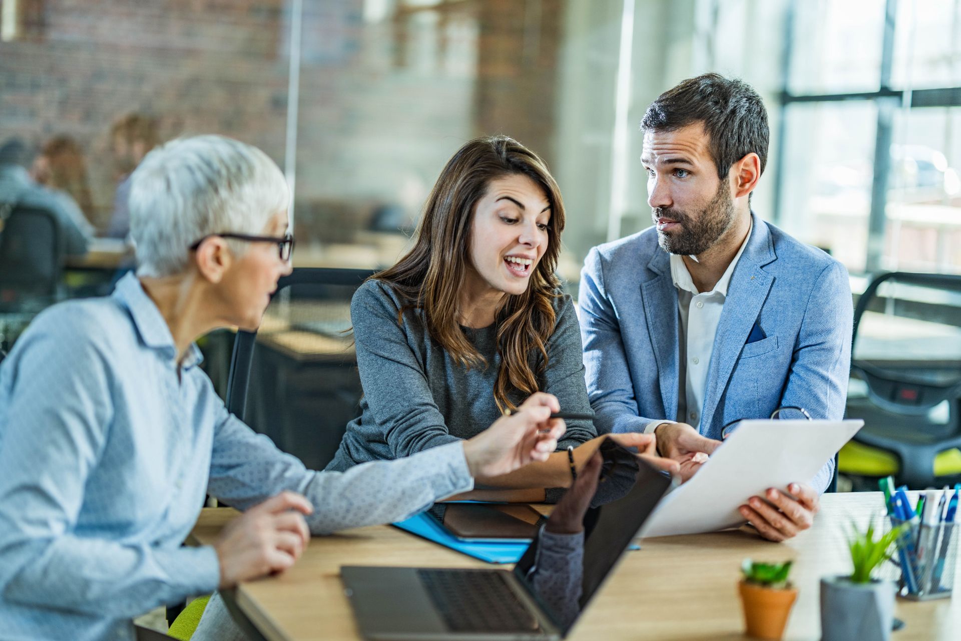 Couple going through lease agreement with their agent in the office