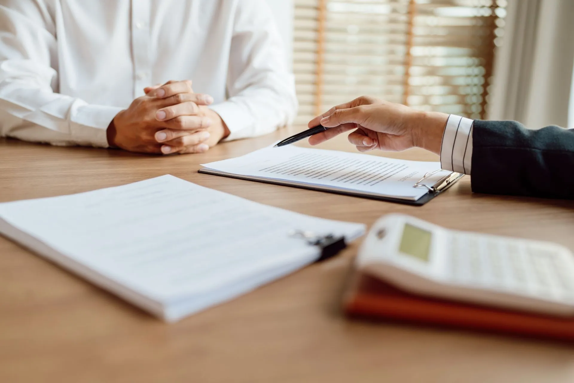 Businesspeople signing a contract