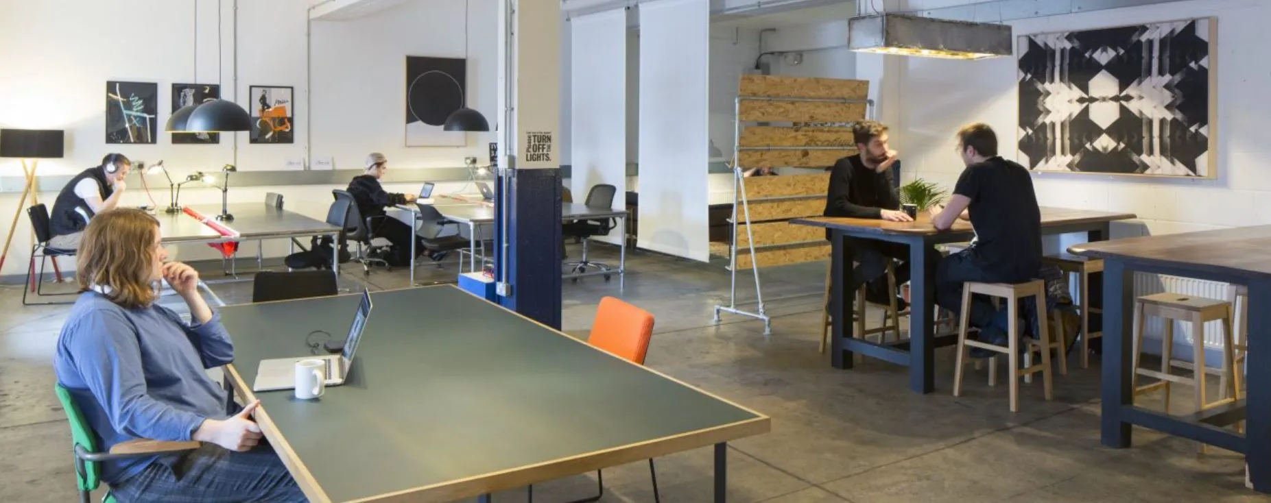 Coworking space at The Distillery with a table tennis table and high stools