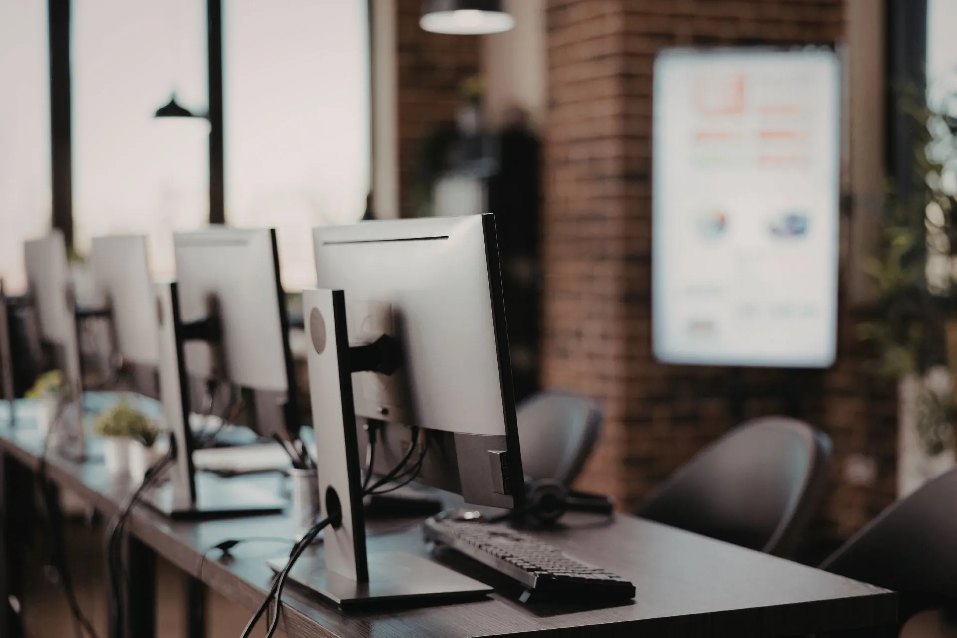 Modern office workstations with computers and chairs