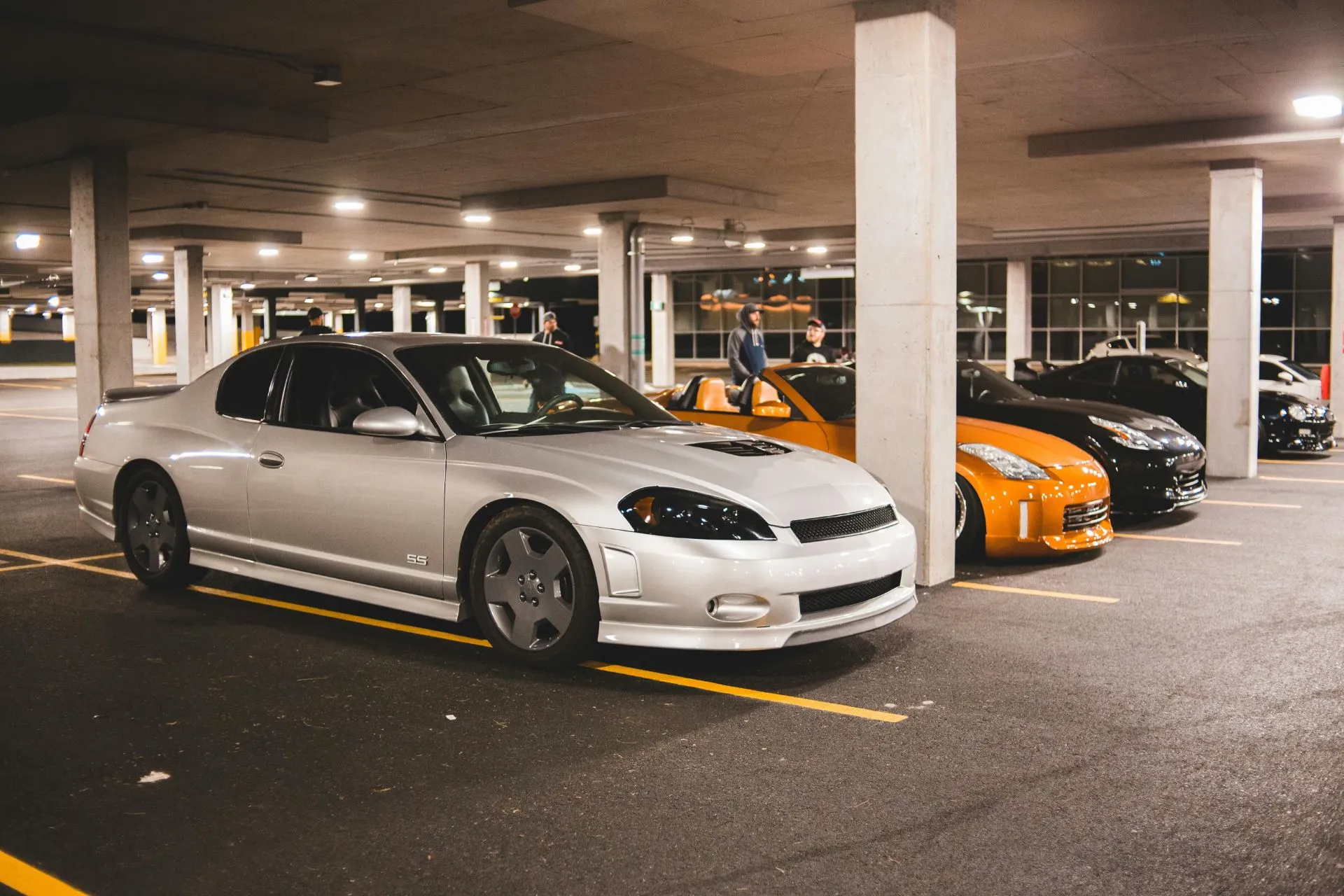 Cars on illuminated parking lot