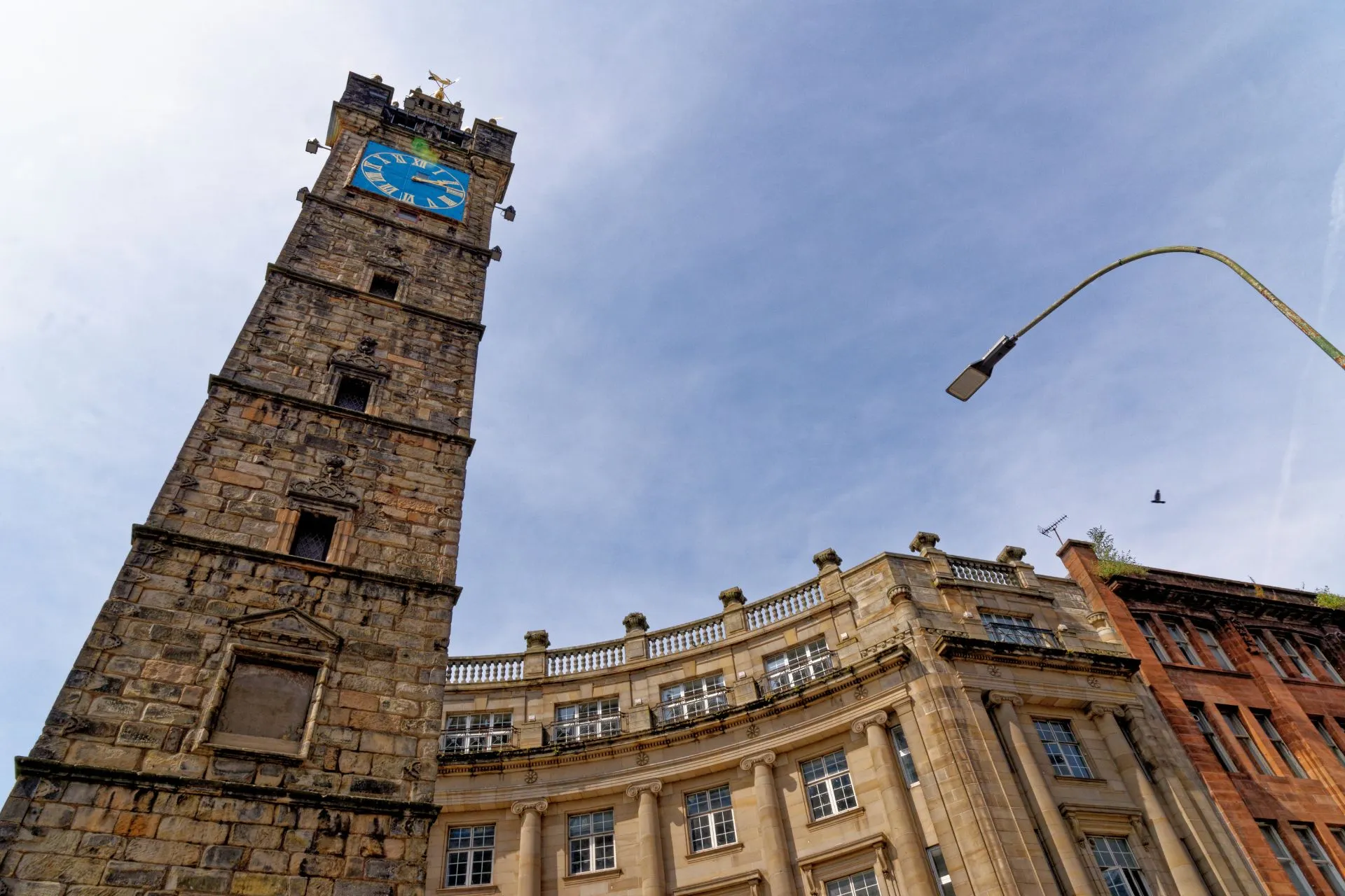 Historic stone clock tower in Glasgow's Merchant City
