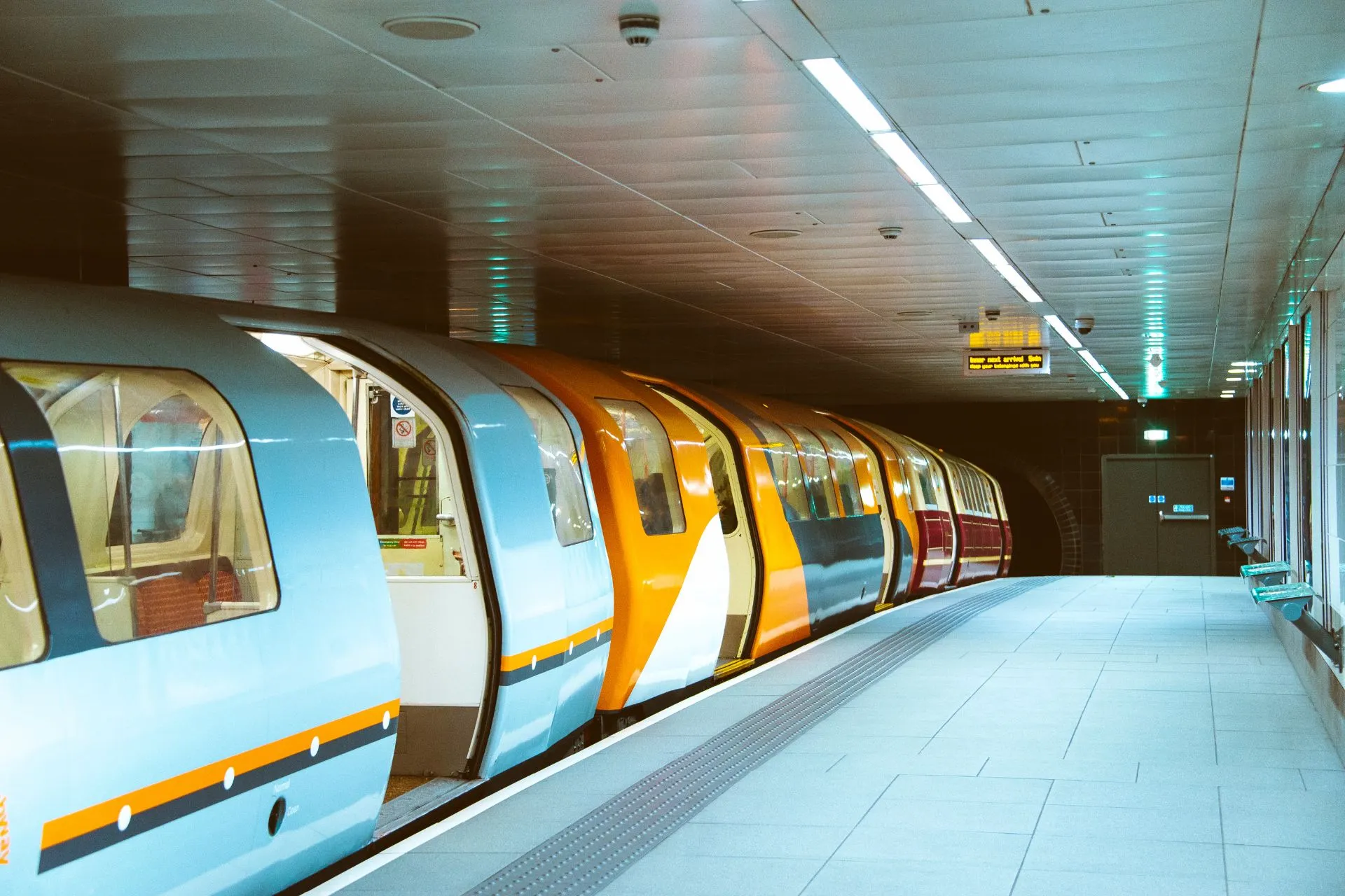 Glasgow Subway train waiting at platform with open doors