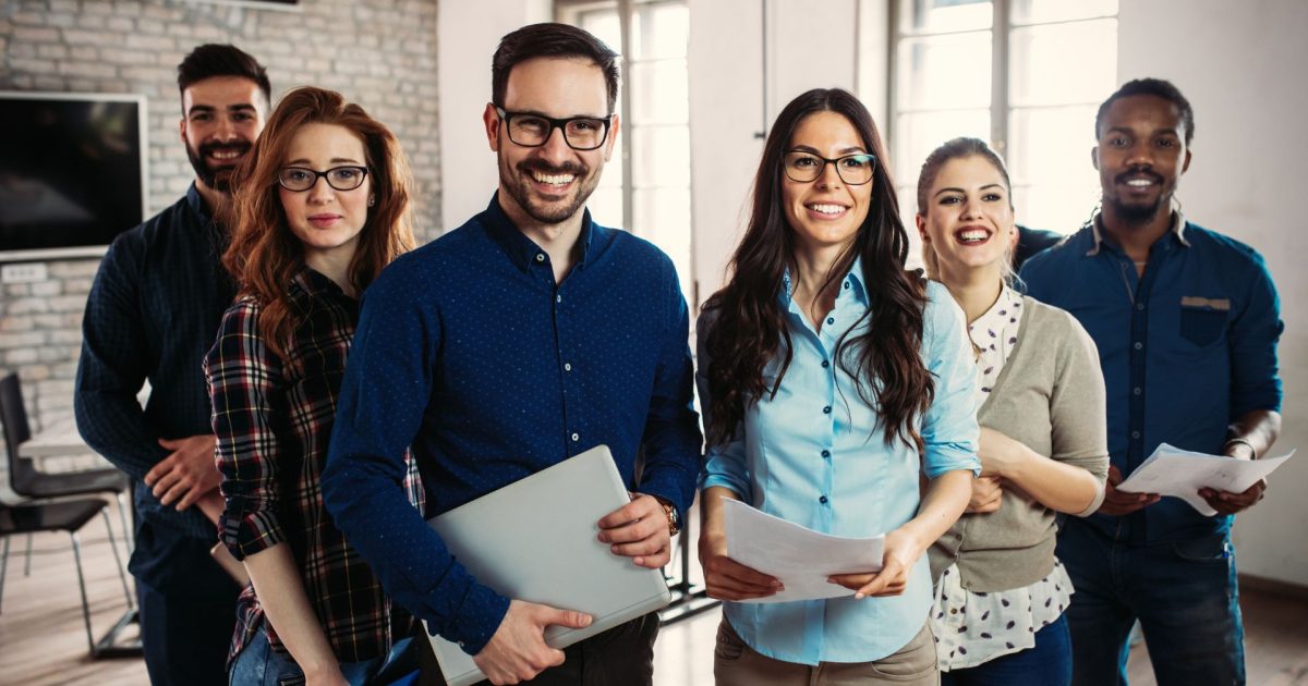 Happy employees in modern office