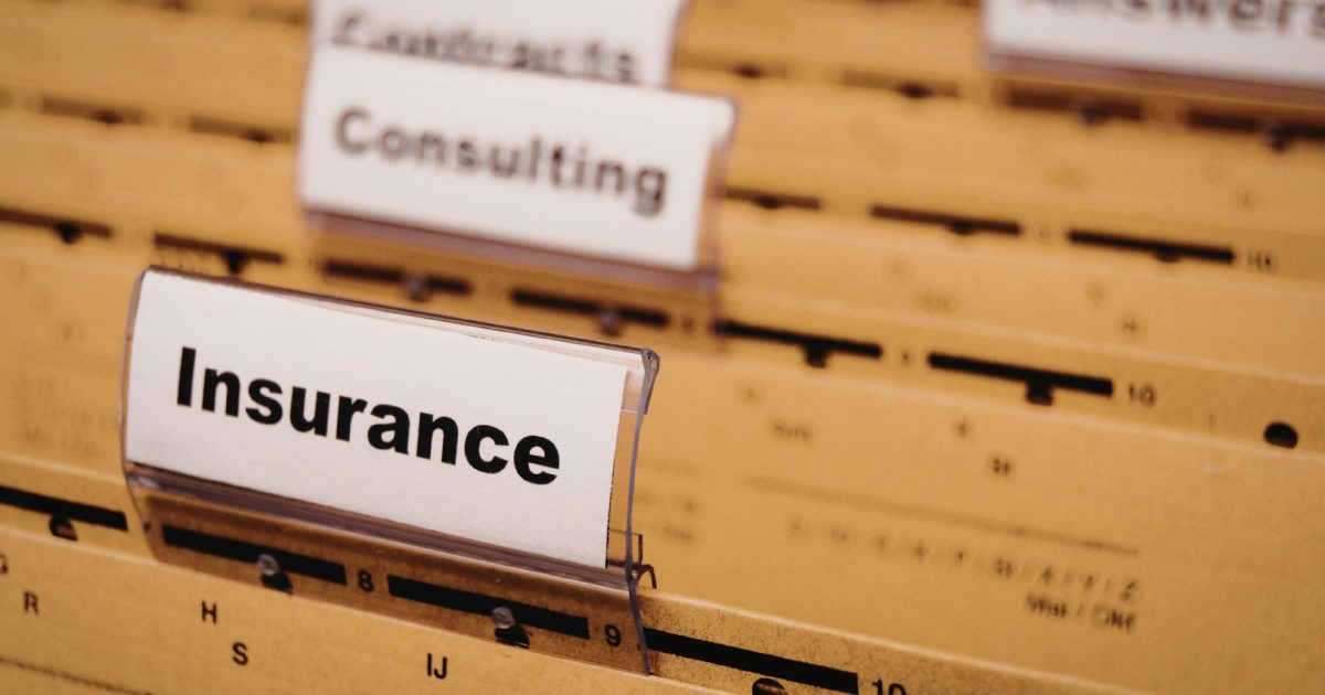 Organized office filing system with insurance label