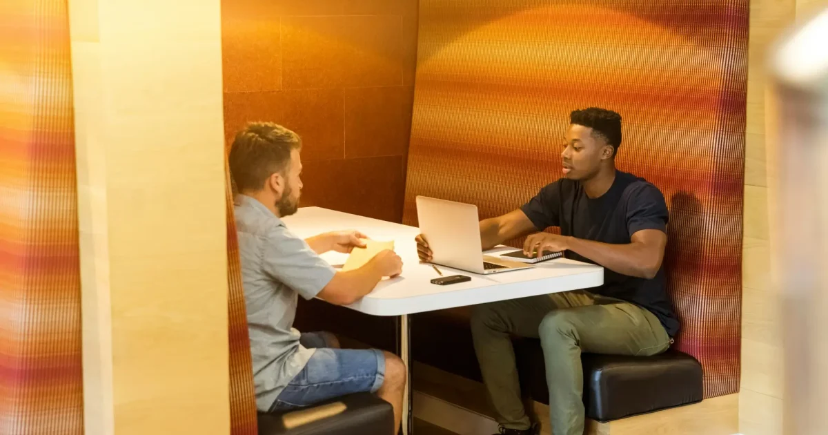 two people working together in private office